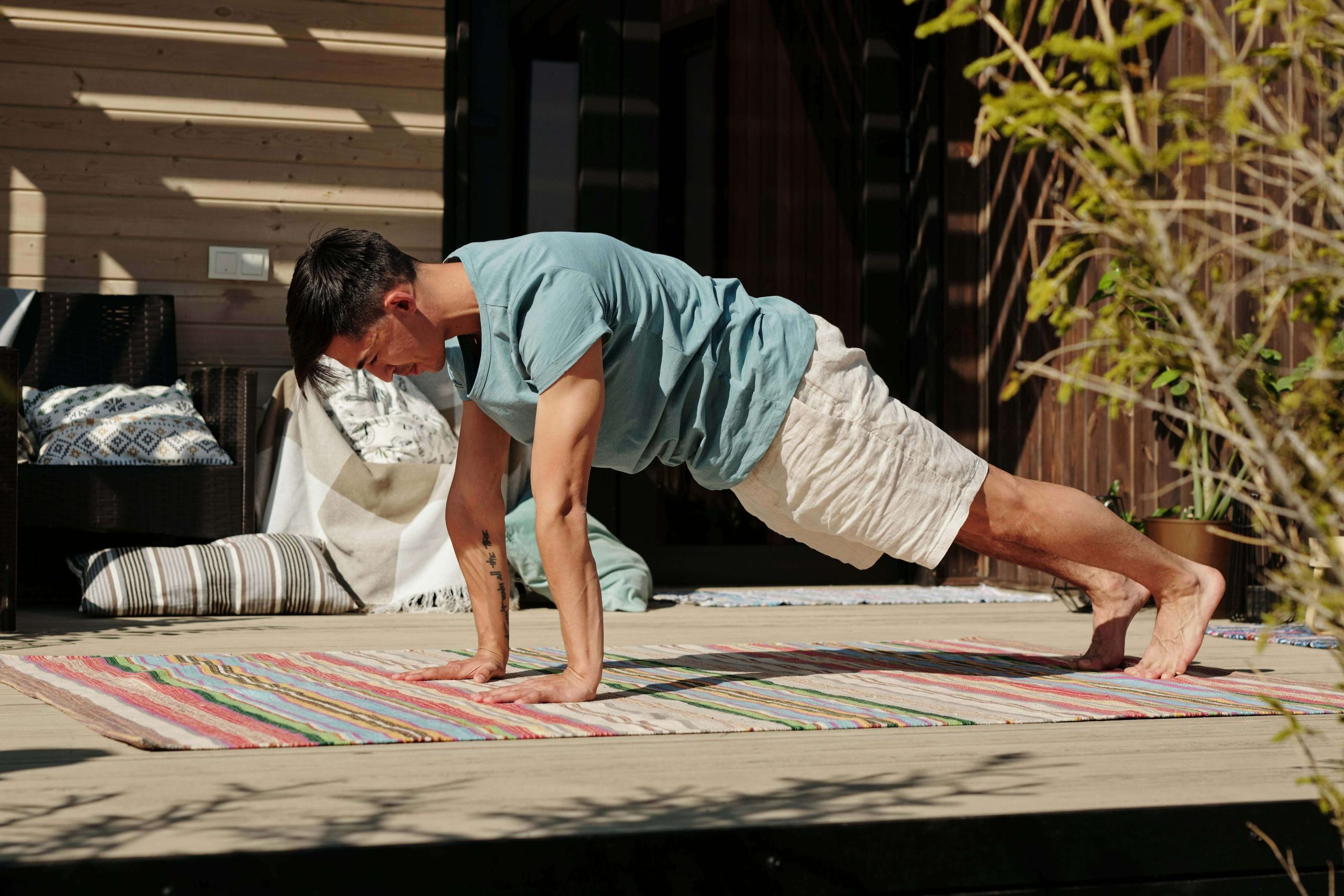 Busy professional man doing a quick home workout on his balcony – Stay fit in just 10 minutes a day
