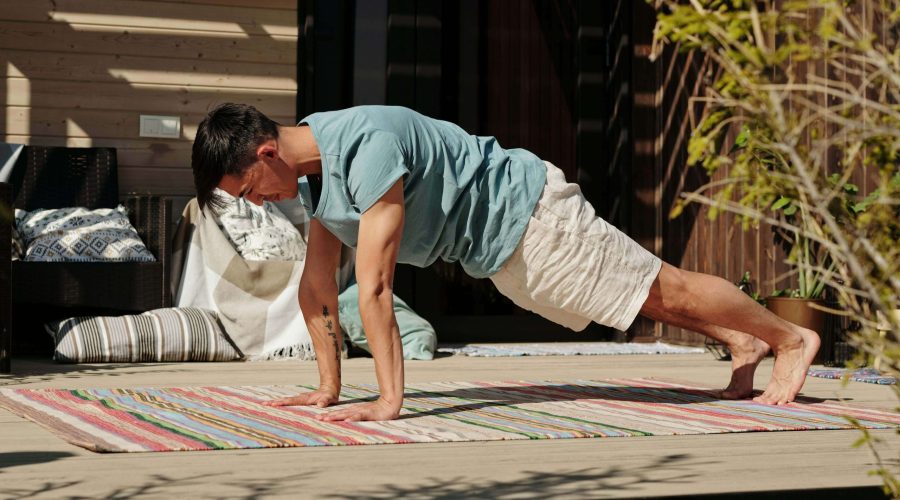 Busy professional man doing a quick home workout on his balcony – Stay fit in just 10 minutes a day